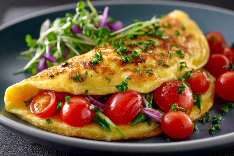 Omelette with tomato and top with parsley , close-up side view.