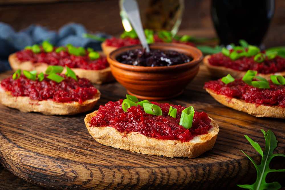 Bruschetta with Grated Beetroot, green onion and side dish of Caramelized Onion