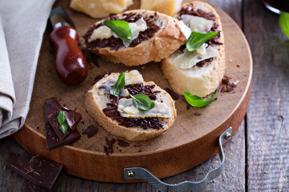 Parmesan and chocolate bruschetta, serve on a wooden board