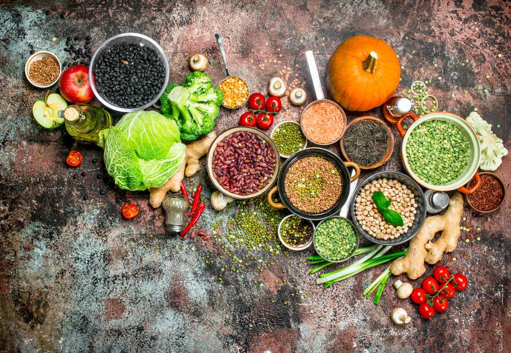 Different vegetables, beans, and herbs laid out before making soup.