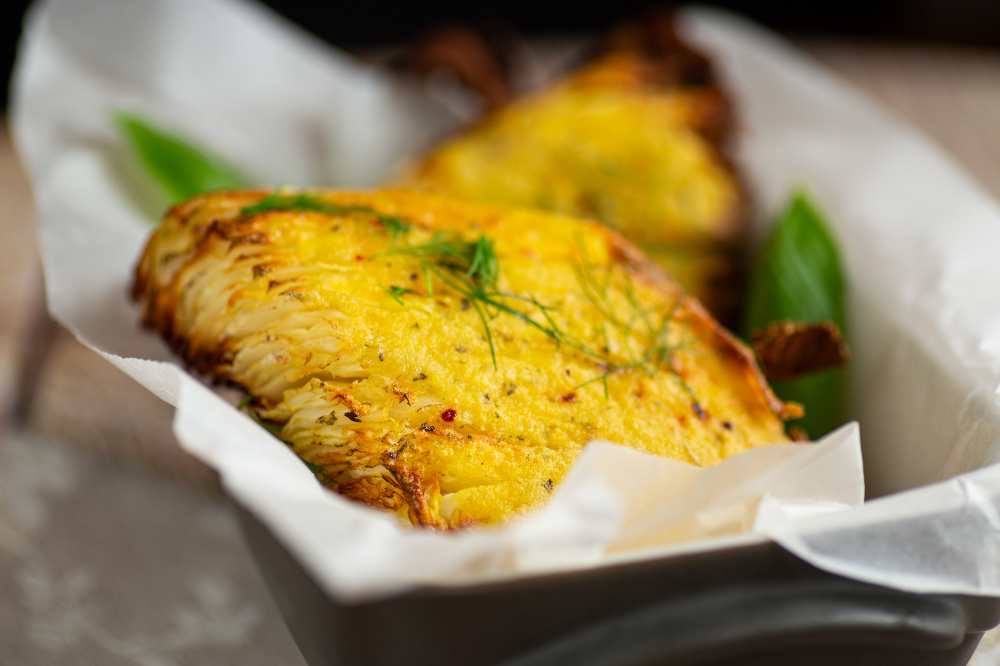 Roasted cabbage in homemade egg batter, top with dill. serve in a baking dish