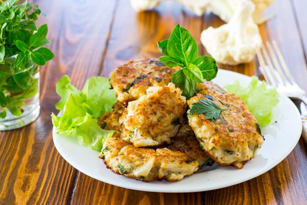 fried cauliflower cutlets, serve in a white plate