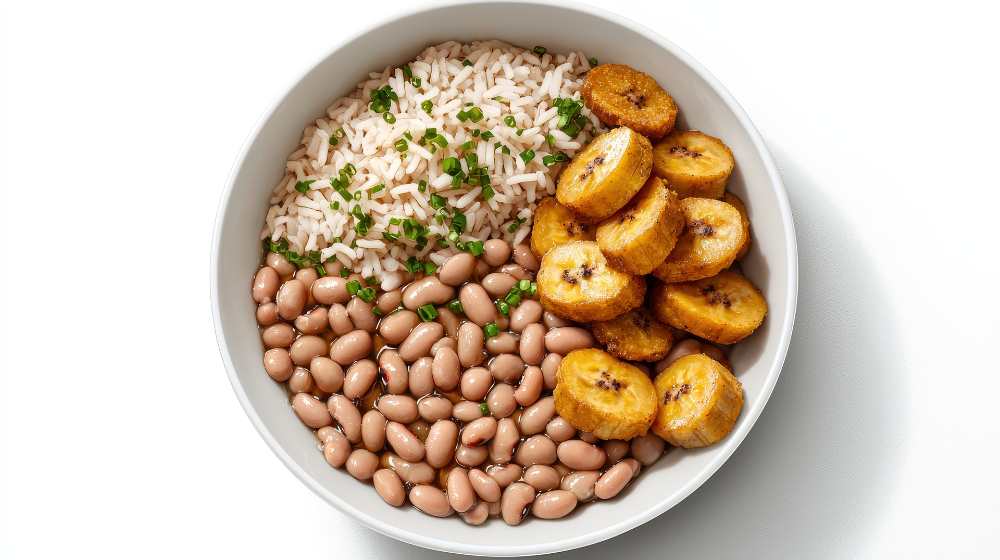 bowl of rice, beans and fried plantains, top view, serve on a white plate in a white background.