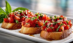 Bruschetta with Tomato and Basil, serve in a long white plate , close-up side view.